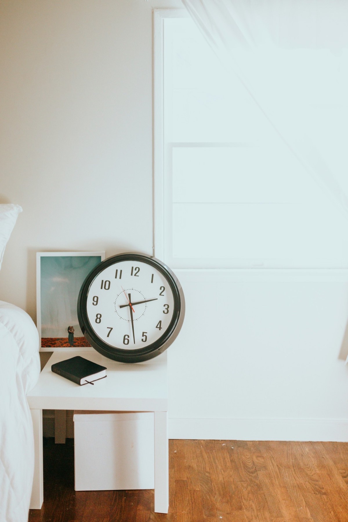 A wall clock reading ten o'clock
