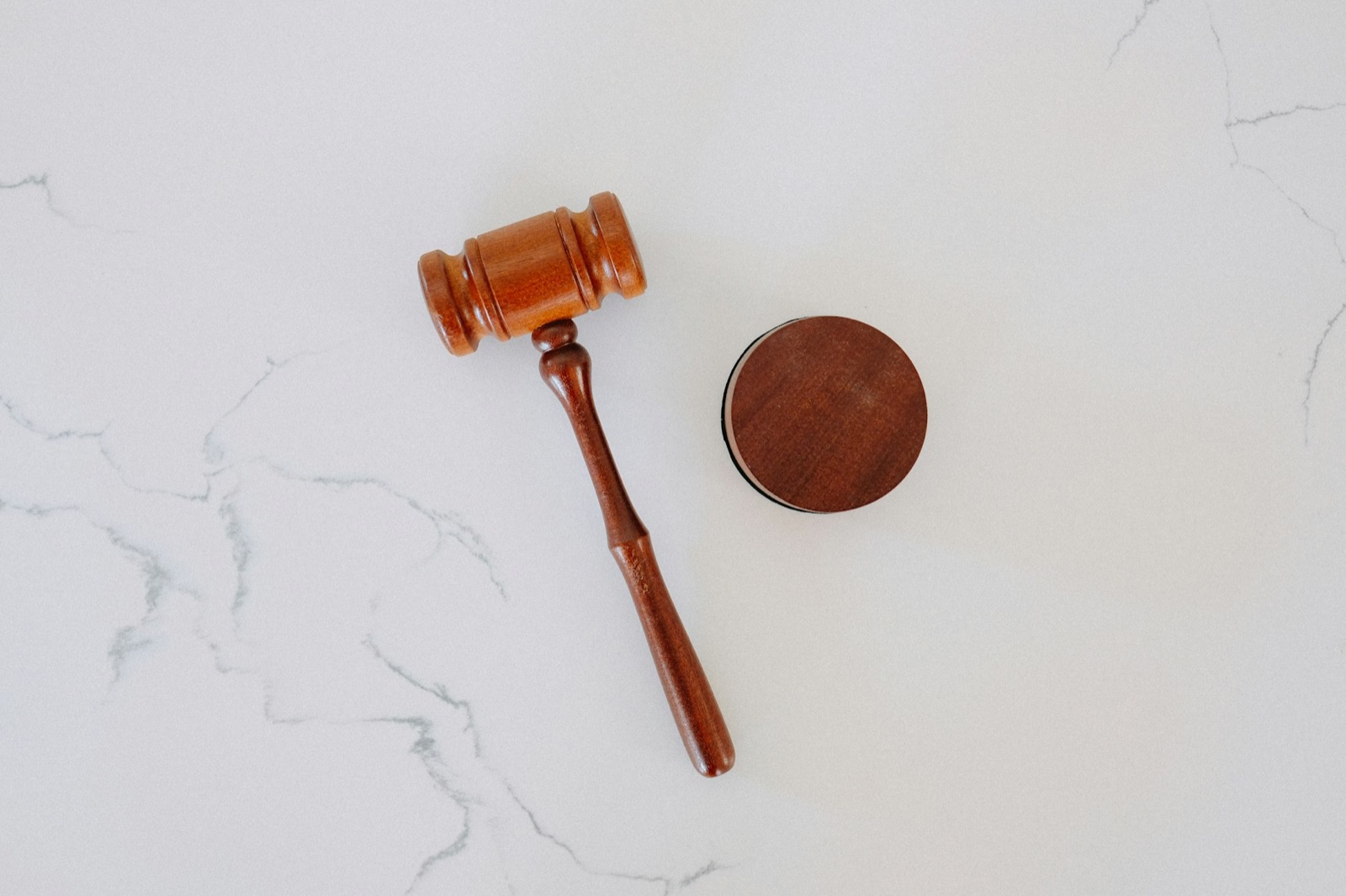 A wooden gavel on marble